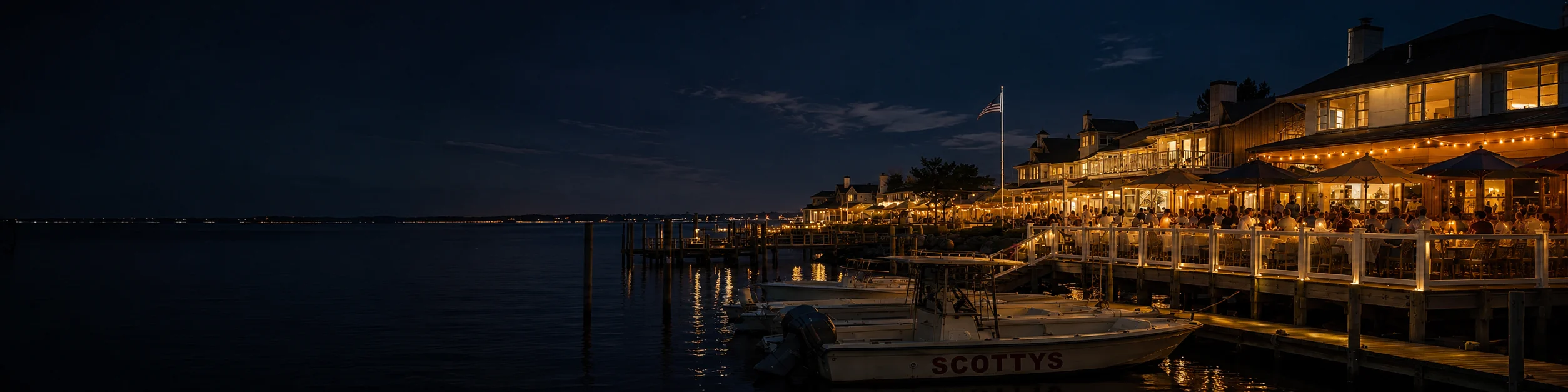 The Buoy Bar waterfront deck at night on Reynolds Channel in Point Lookout, New York